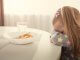 child refusing to eat her food
