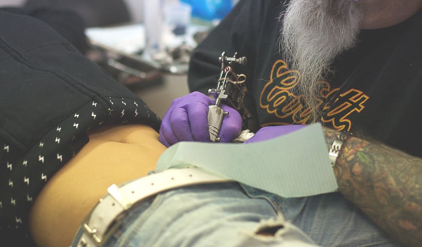 woman getting a tattoo