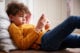 young boy using a cellphone